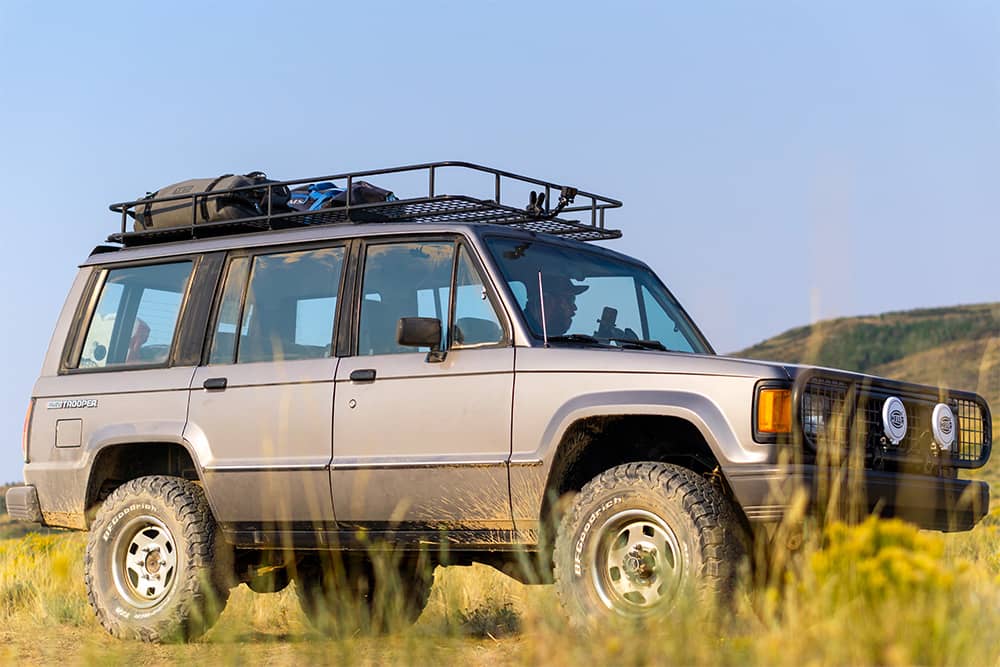 Isuzu Trooper 1st generation grey with roof rack