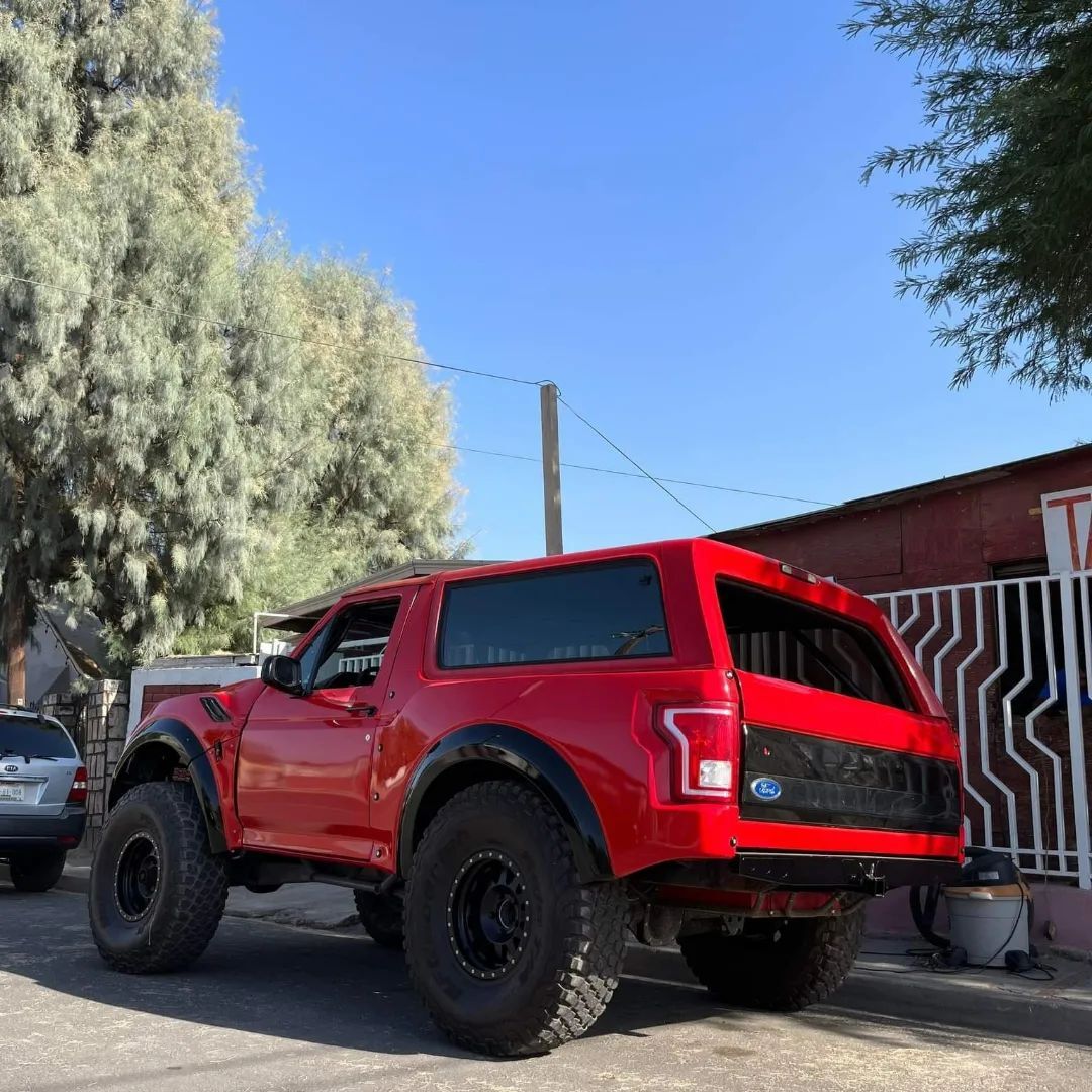 Red 1996 Ford Bronco Prerunner on 40" offroad wheels