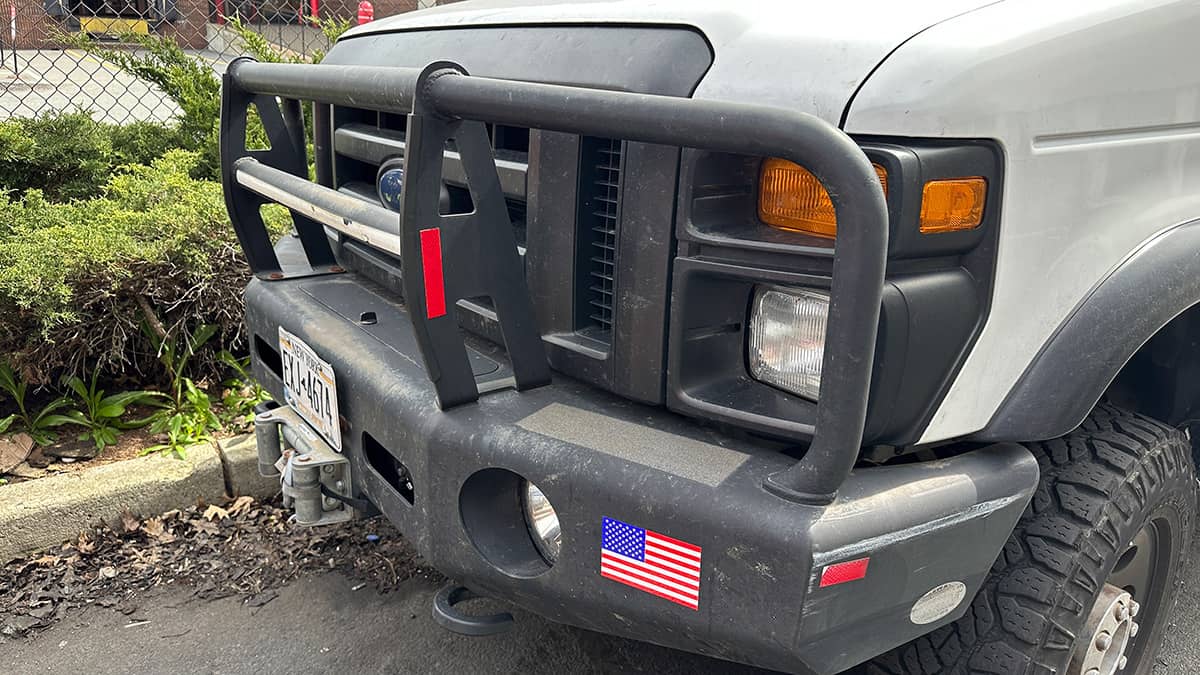 12,000lb Warn winch on custom front bumper by Buckstop with grille guard