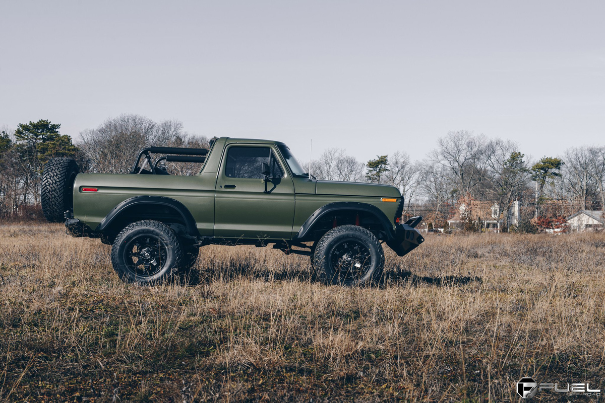 Matte Green Olive Drab Ford Bronco with an open top