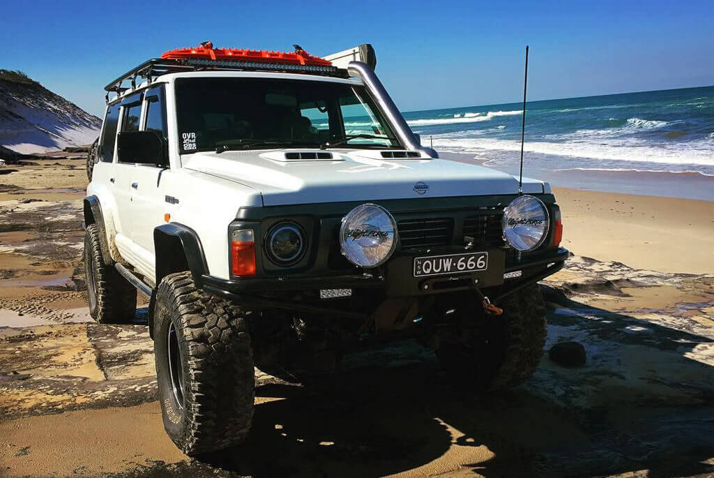 White Nissan Patrol Y60 off-road modifications
