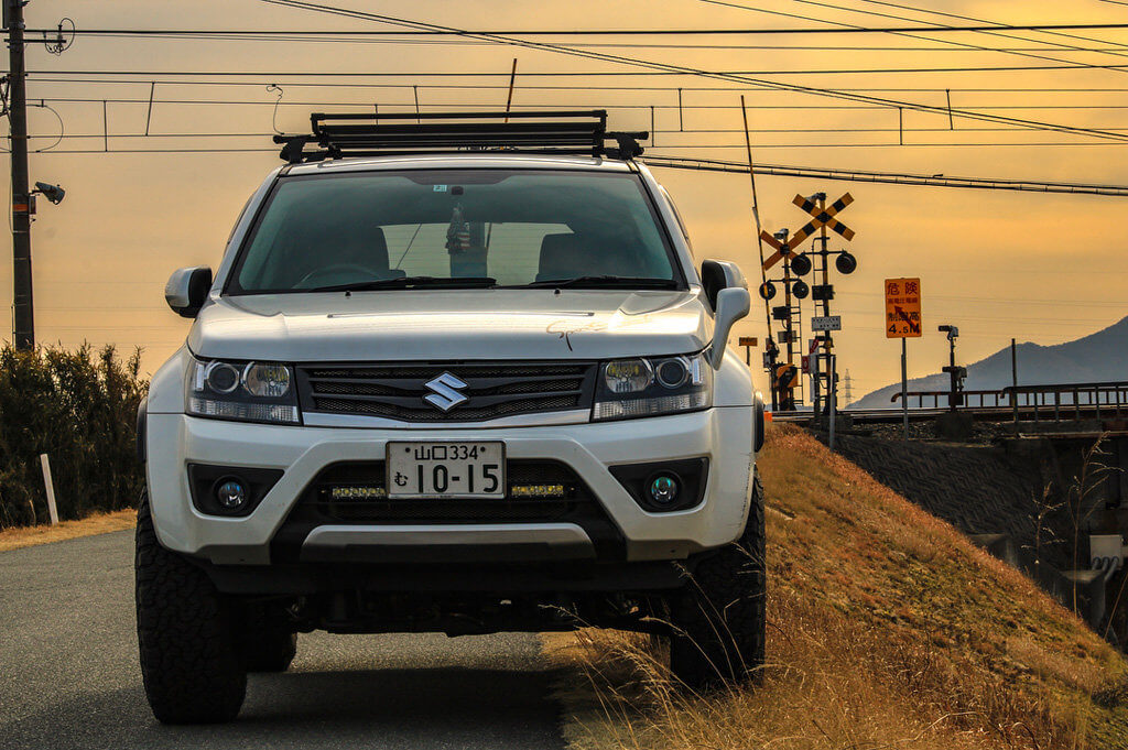 White Suzuki Escudo with a Roof Rack