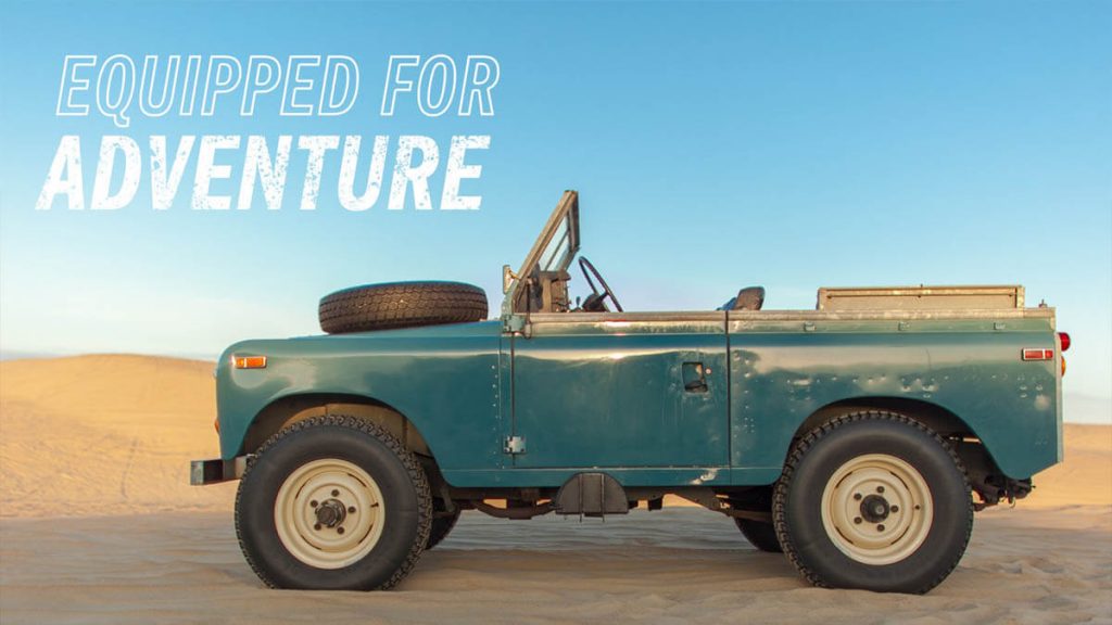 Land rover series III with a tire on the hood