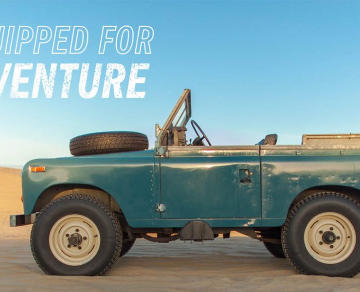 Land rover series III with a tire on the hood