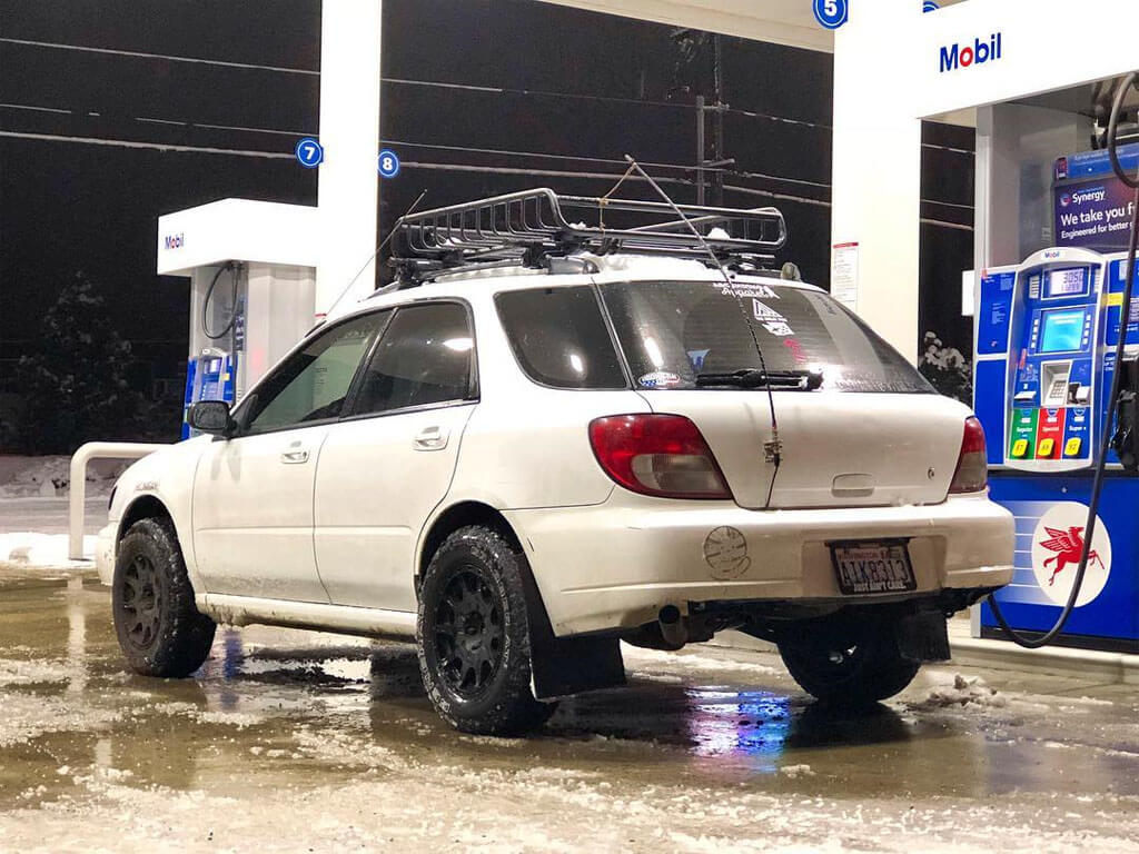 subaru impreza lifted in the snow