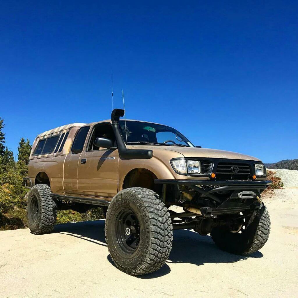 Lifted Tacoma with a camper shell