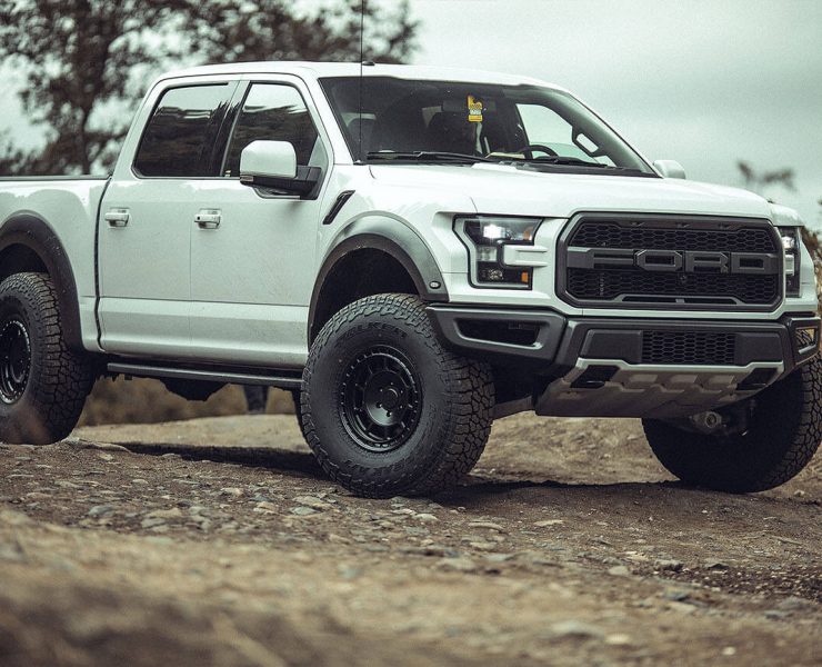 White ford Raptor on Black Off-road wheels