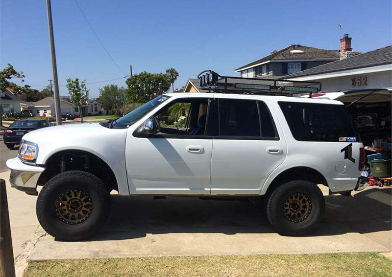 Modified Ford Expedition Prerunner SUV with long travel suspension