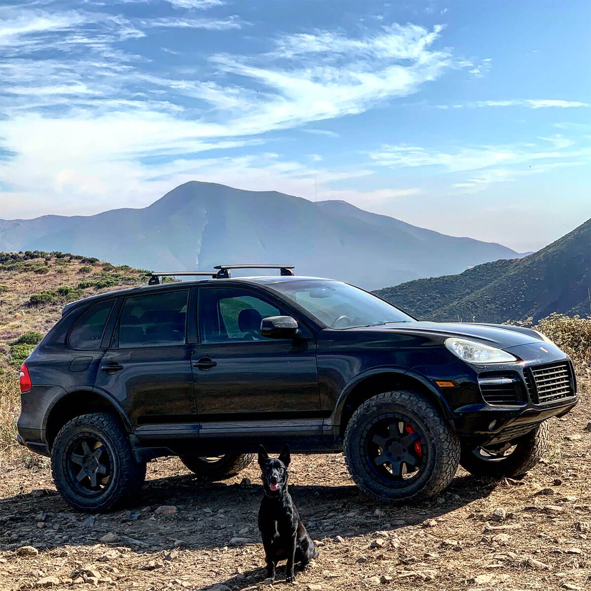 Black Porsche Cayenne with off-road mods and 33 inch mud tires