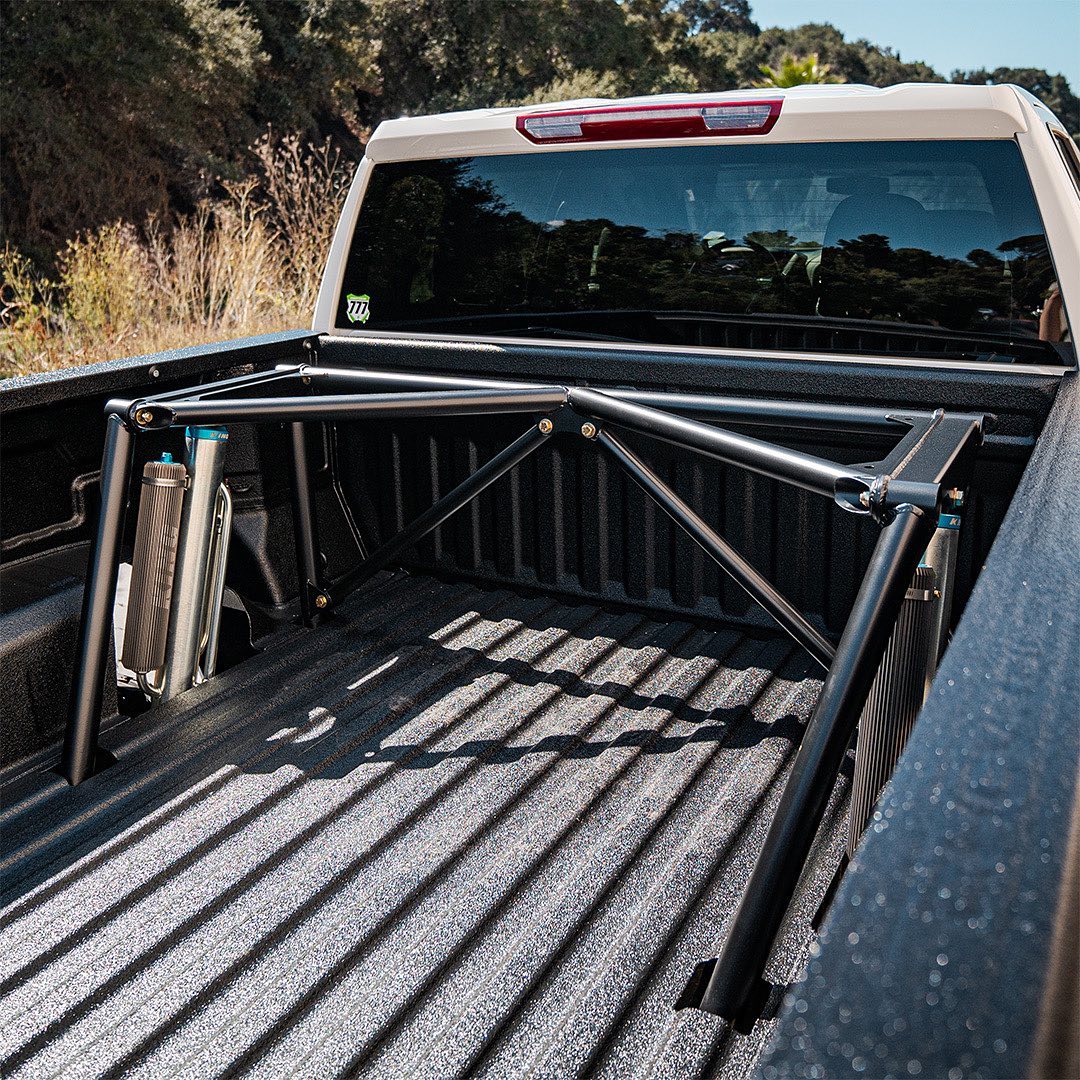 Custom rear long travel suspension in the truck bed chevy silverado