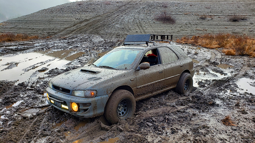 Lifted Subaru Impreza Wgon in the mud