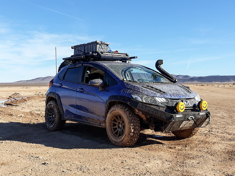 Lifted Honda Fit Battlewagon on Xxr 527 16x8 0 offset and kenda klever mud tire 245 75r16