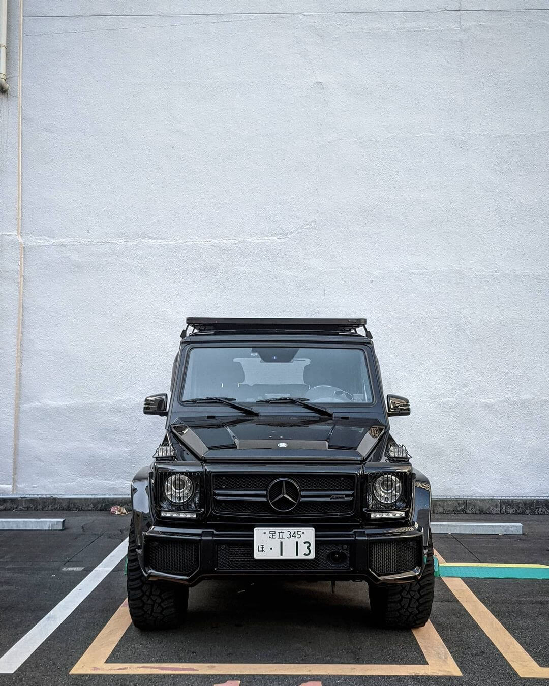 Black Mercedes G63 with a roof rack