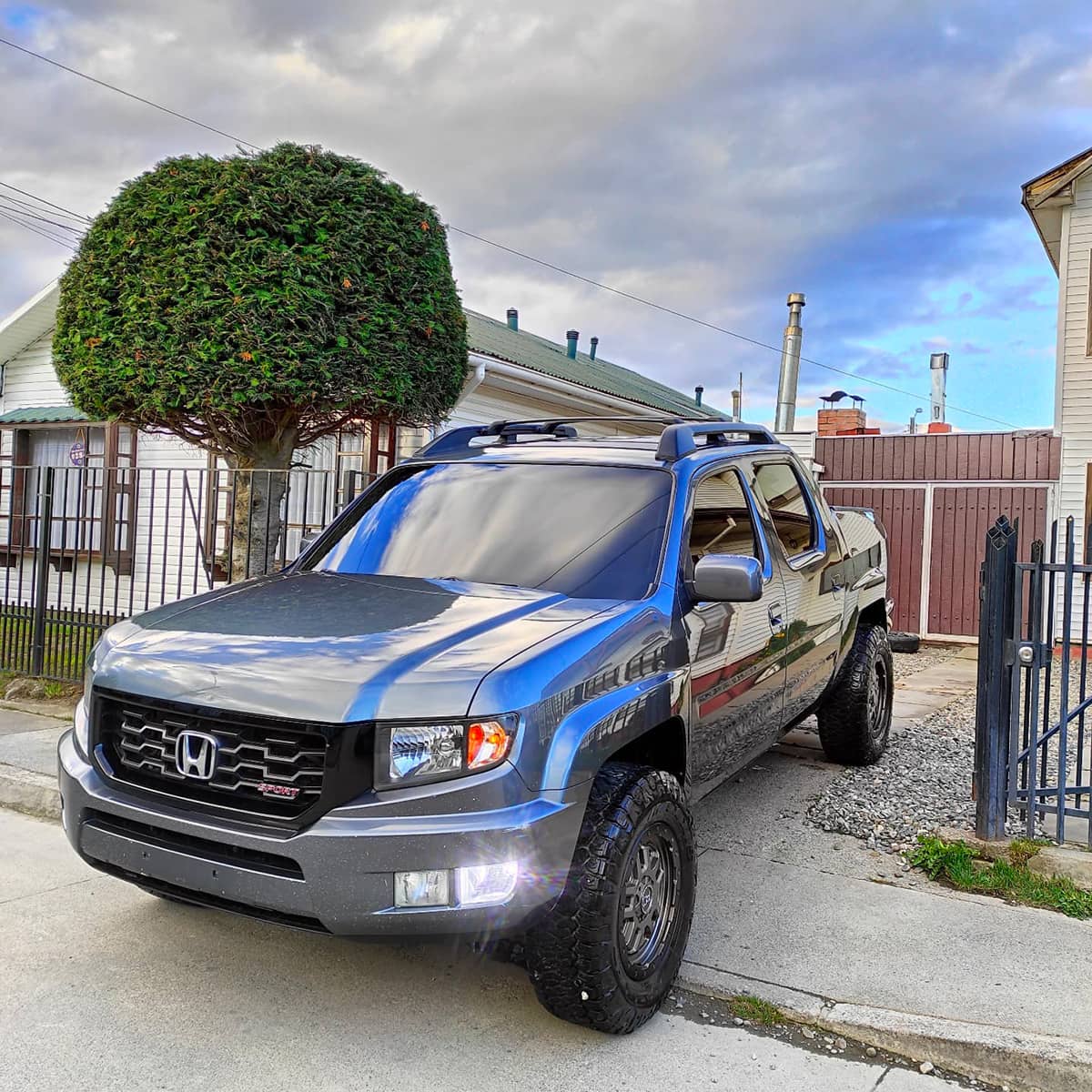 Lifted Honda RIdgeline with off road wheels and a lift