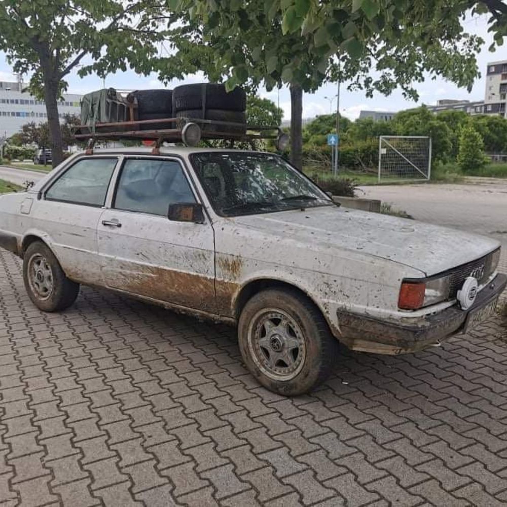 Lifted Audi 80 S2 sedan with off-road wheels, lifted suspension and a roof rack