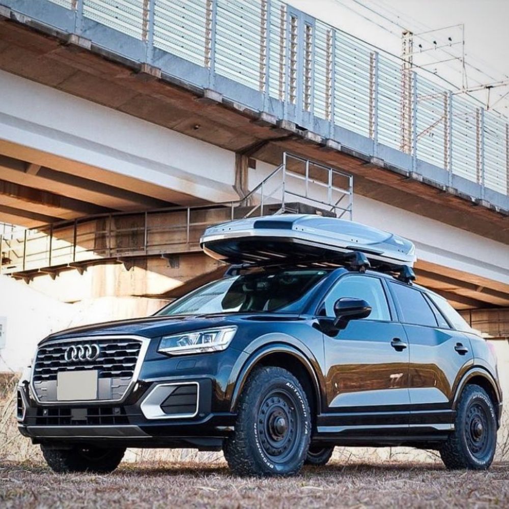 Black Audi Q2 On All terrain tires with roof box