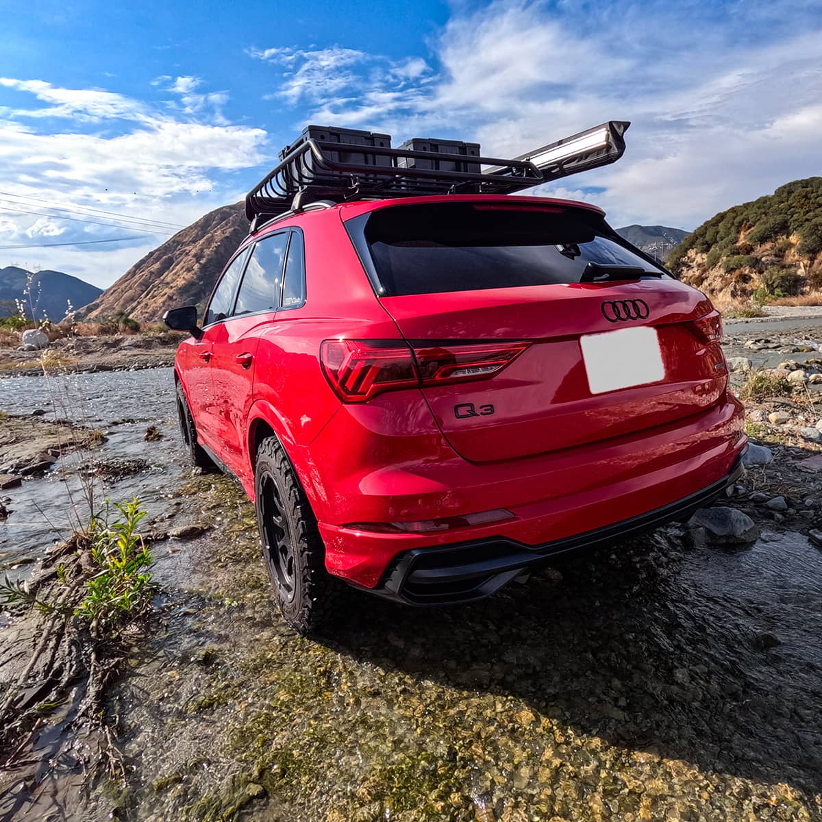 Red 2022 Audi Q3 S-line offroading in the dirt