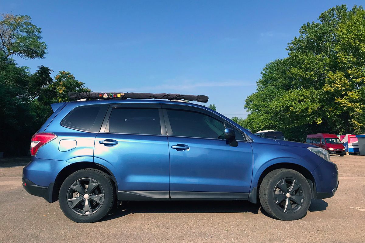 blue Subaru Forester SJ with custom awning