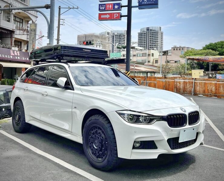 Timebox rooftop box in closed position on a white BMW F31 M Sport Touring on city street