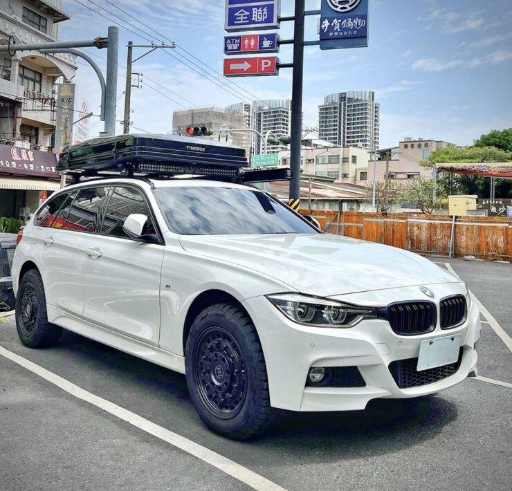 Timebox rooftop box in closed position on a white BMW F31 M Sport Touring on city street