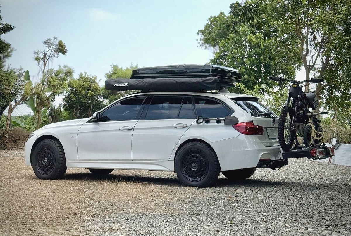 225/60R17 all-terrain tires on a lifted white BMW F31 Touring wagon