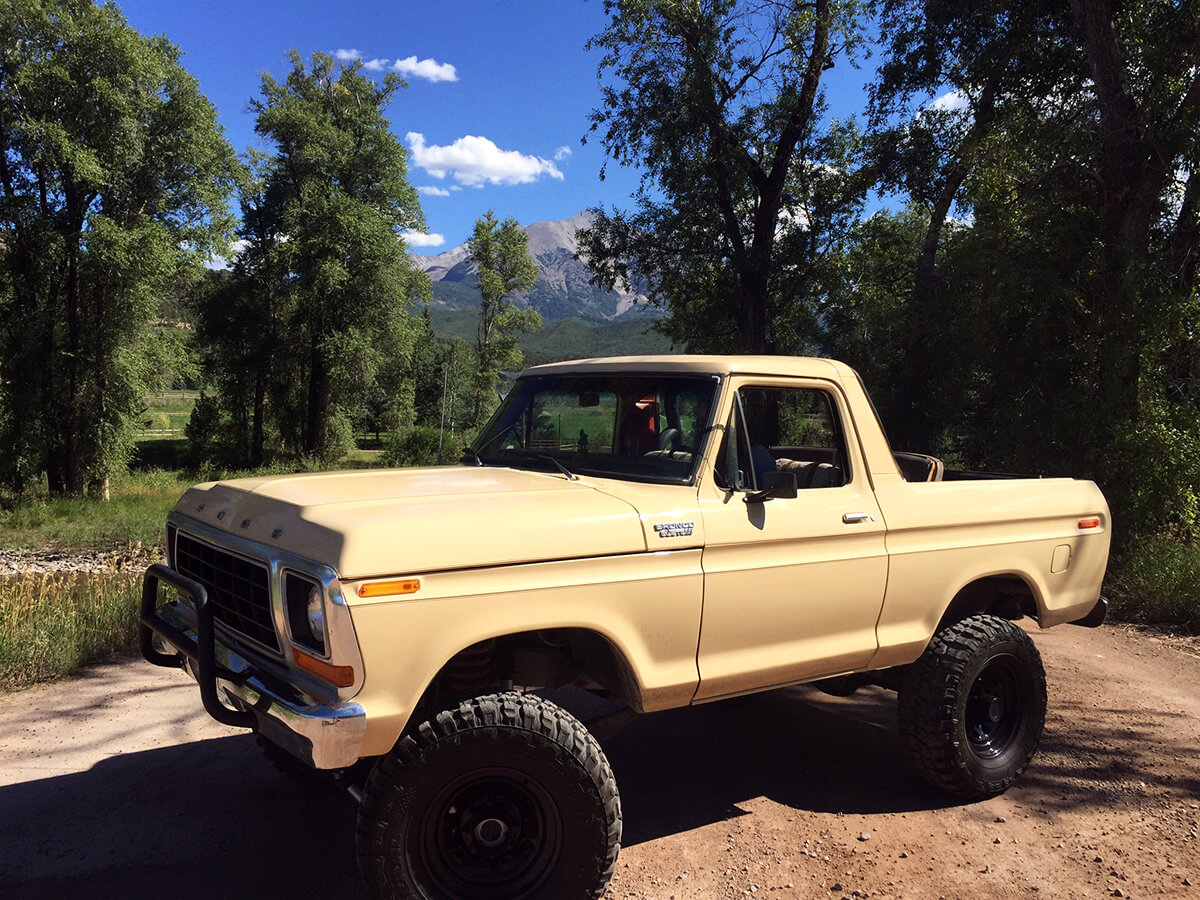 tan full-size Bronco with an open top
