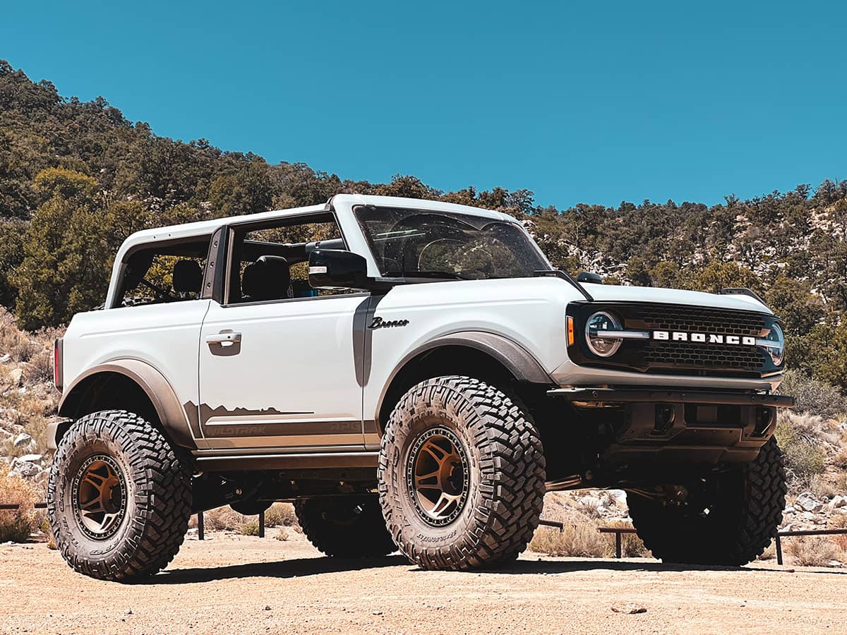 2-door ford bronco with top off - wildtrak on 37s