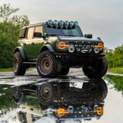 Lifted ford bronco Big Bend off road build on 37s in green color and bronze wheels