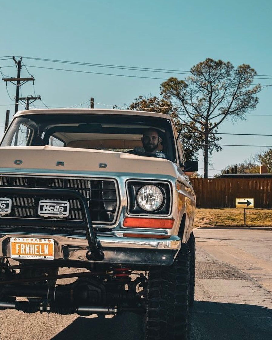 Texas FRWHELN vanity plate on the front bumper of a lifted Ford Bronco FSB