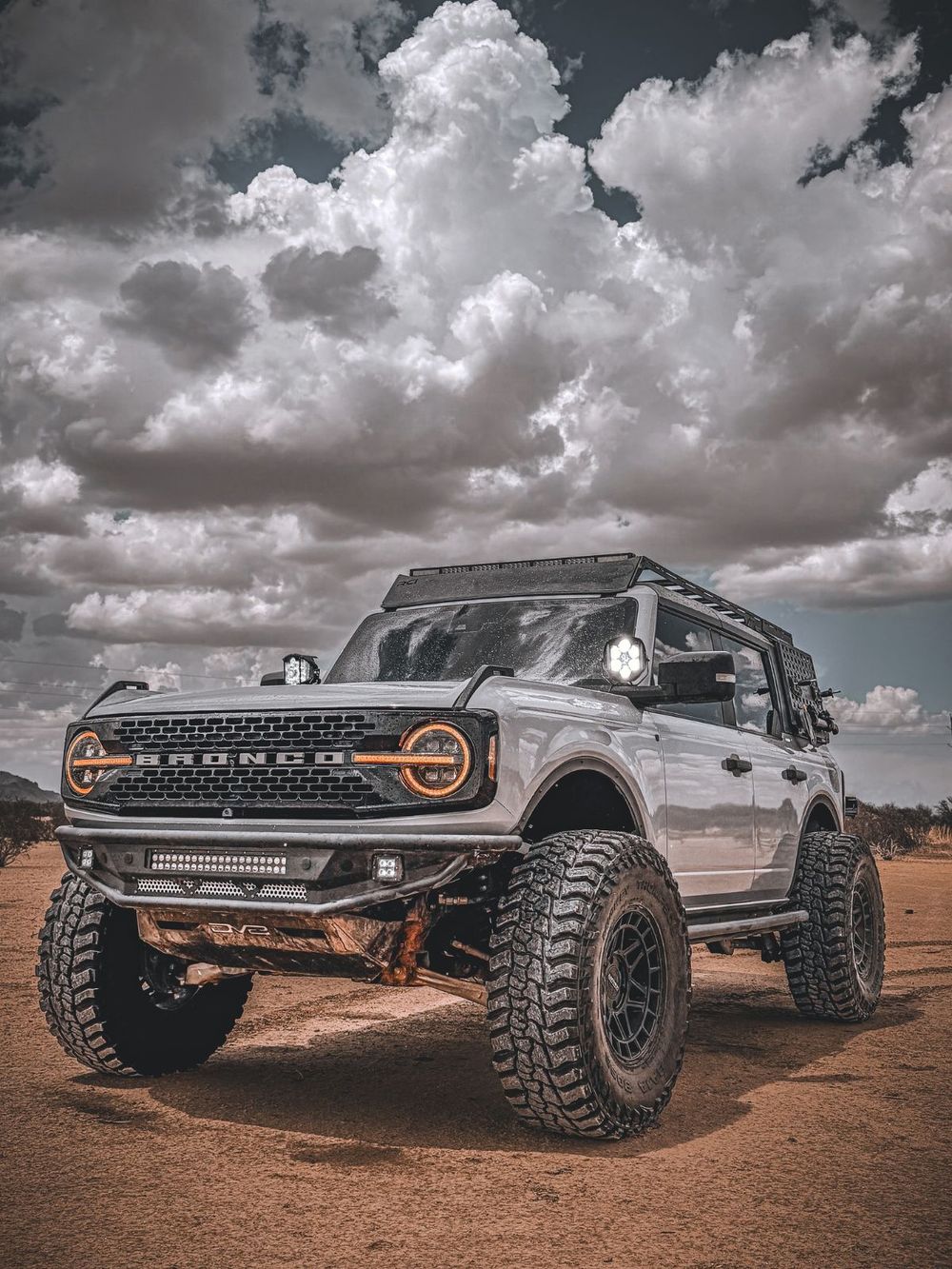 ICON Stage 4 coilover suspension lift visible under a Ford Bronco on desert terrain