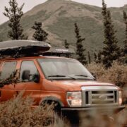 2008 Ford E350 7.3L with a roof rack and cargo box