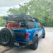 Ford Raptor with a bed rack and roof top tent rtt