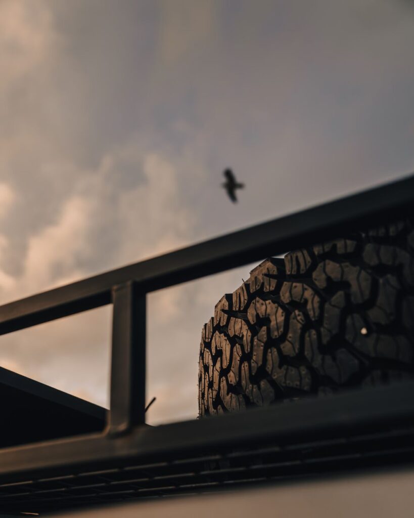 Full size spare tire in the roof basket