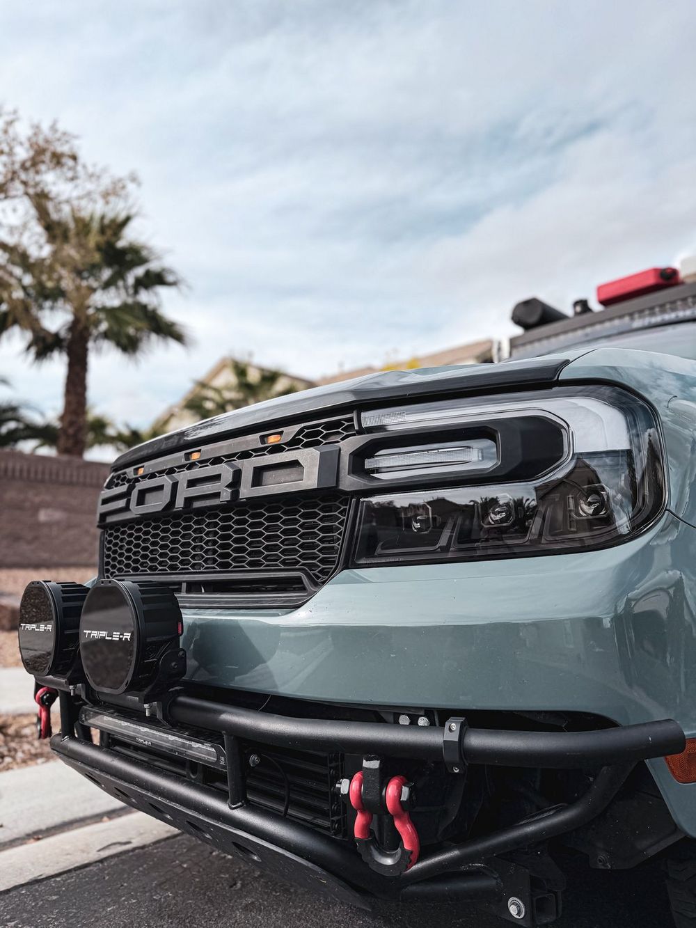 Ford Maverick with custom tube pre-runner bumper and Tripler off-road lights mounted