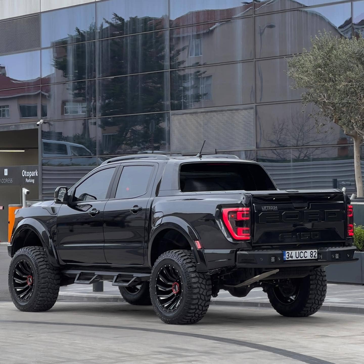 Lifted Ford Ranger with Gen 3 Raptor Conversion on 35x12.5R20 Tires and a lift.