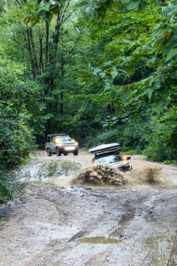 Lifted GMC Terrain 2nd gen offroading in a deep mud puddle