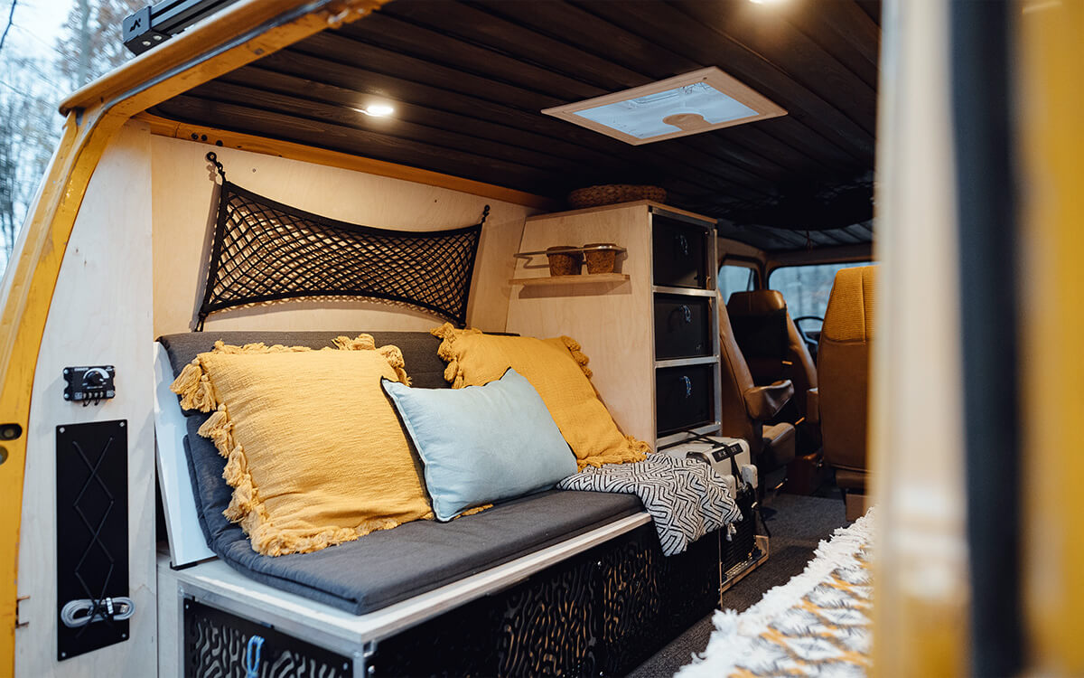 Custom bed and kitchen in a van