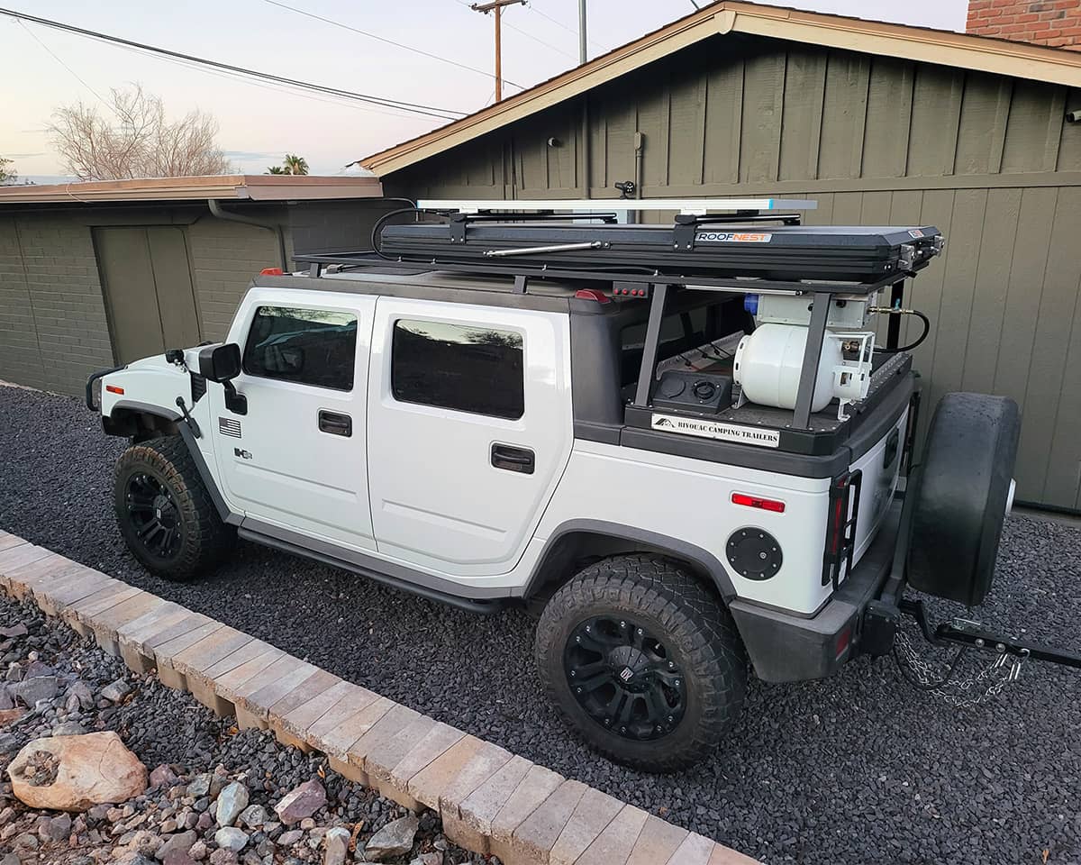 Hummer H2 with a 200 watt solar panel mounted on the roof rack
