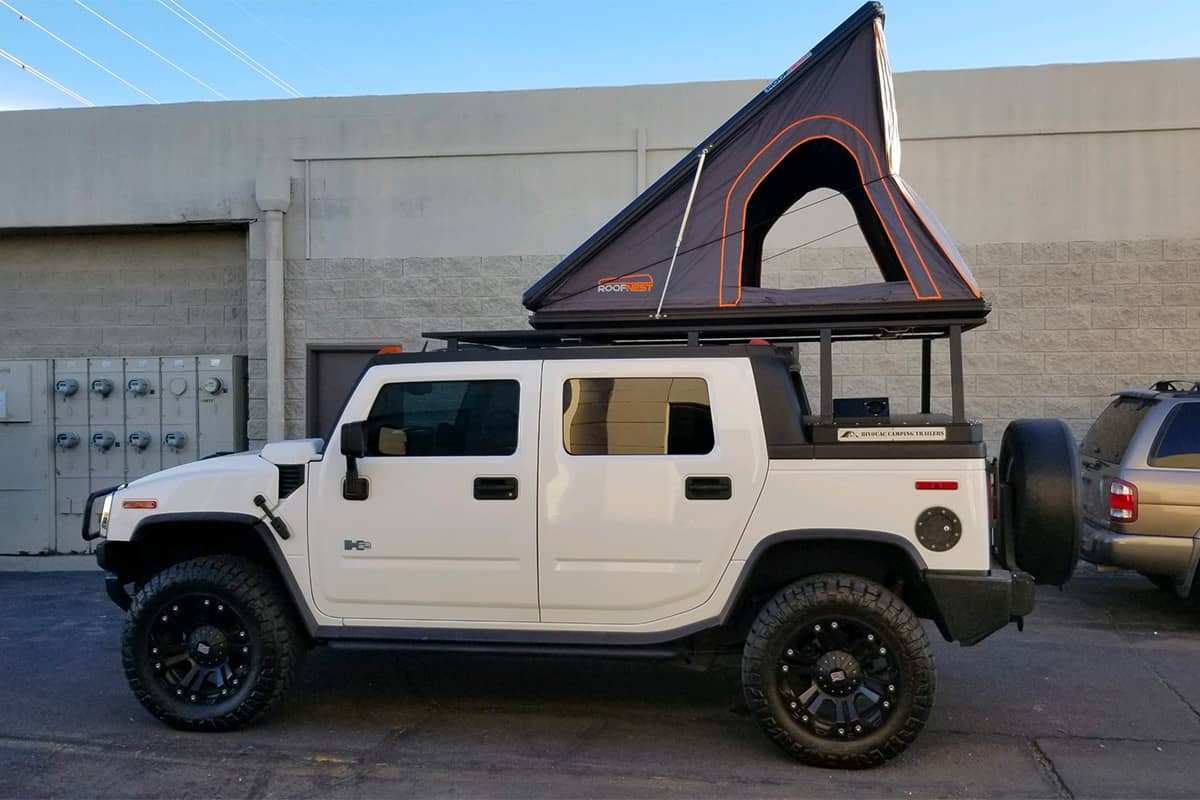 Hummer H2 SUT truck with a Roofnest Falcon XL roof top tent
