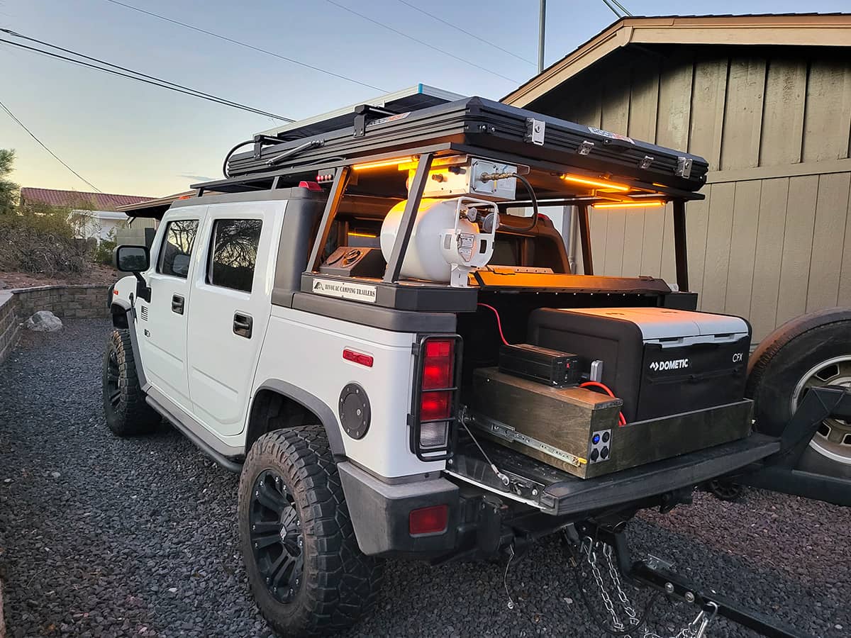 Hummer H2 SUT truck bed setup with a bed rack, drawers and Dometic Fridge