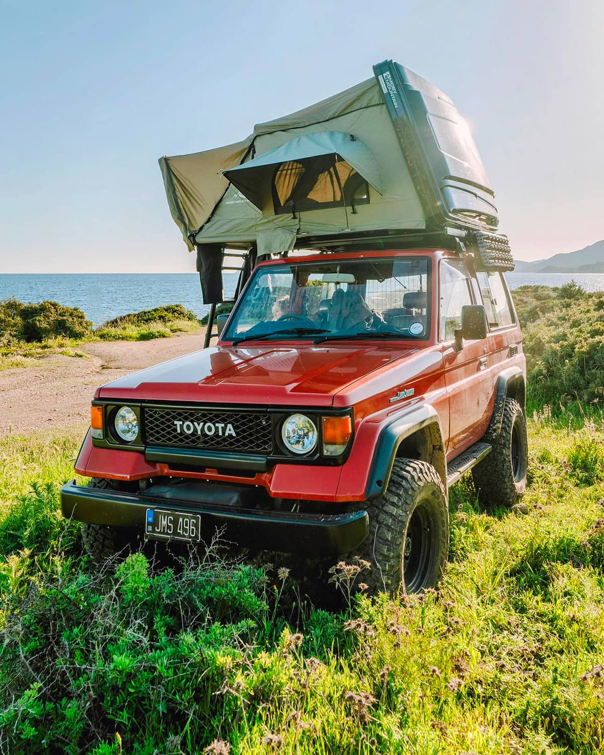 Toyota Land Cruiser 70 with a Hard shel roof top tent for overlanding