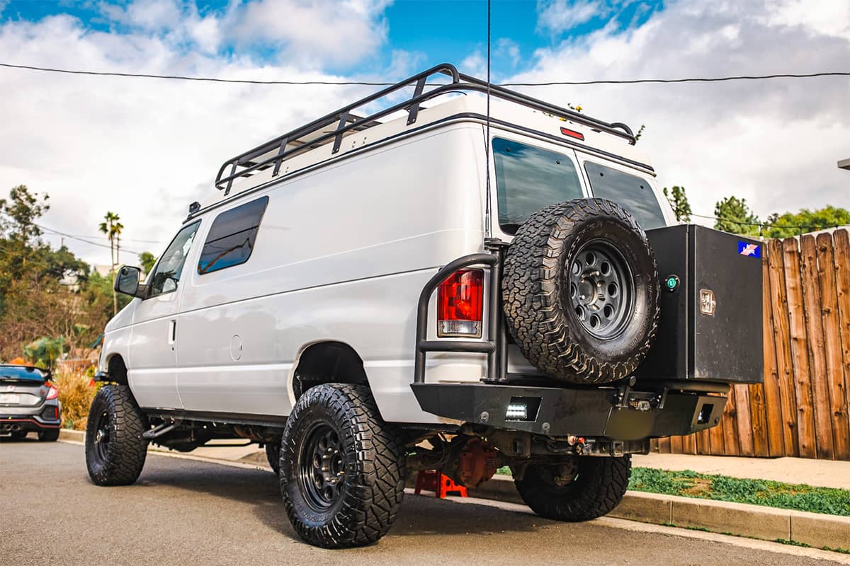 Ford E250 4x4 Camper van with Aluminess rear bumper with storage, swing box and tire carrier