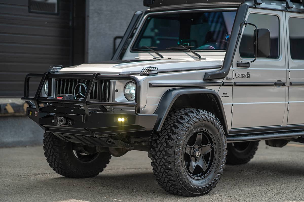 Silver Grey Mercedes G Wagon with off-road mods, black wheels and overland upgrades