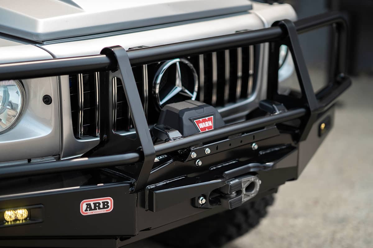 ARB winch mount bumper from Land Cruiser 70 series bumper installed on a Mercedes G-Class G wagon with custom brackets.