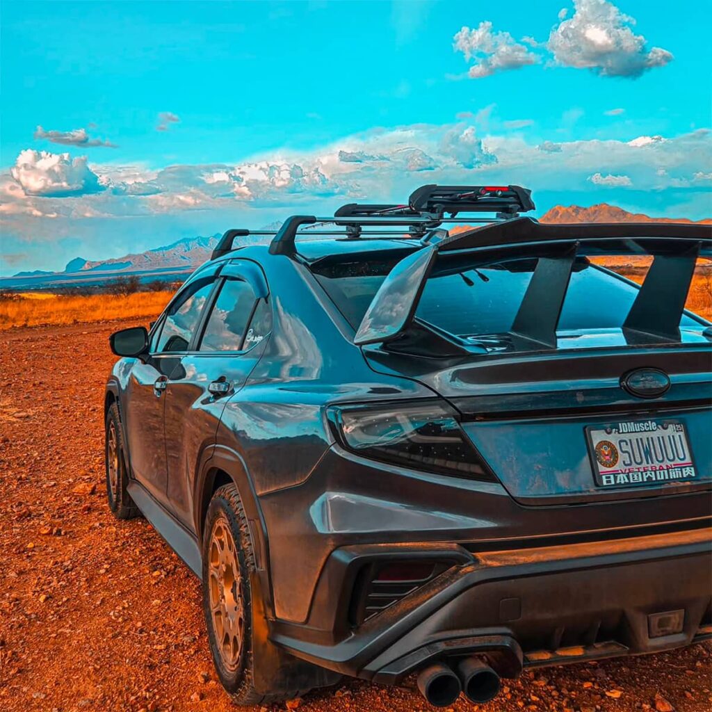 JDMuscle WRX STI wing, blacked out headlights and custom exhaust pipes