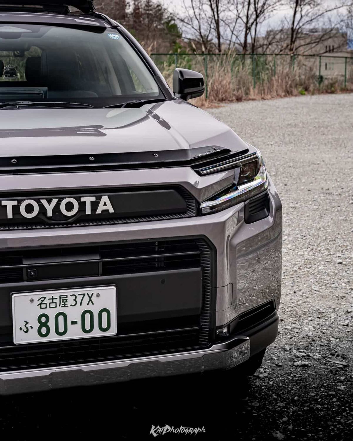 Large TOYOTA lettering on the custom aftermarket front grille of a 6th gen RAV4