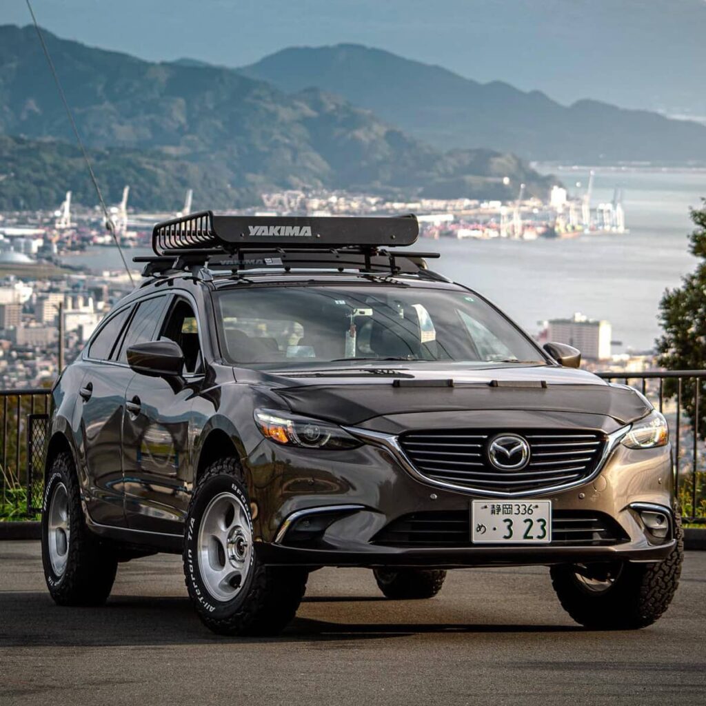 Lifted Mazda 6 Offroading with yakima cargo basket on the roof rack