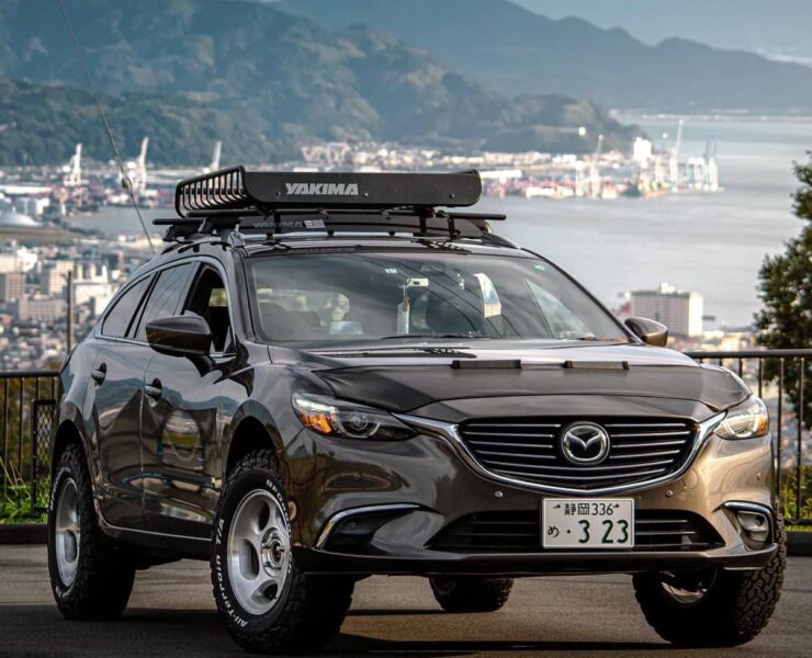 Lifted Mazda 6 Offroading with yakima cargo basket on the roof rack