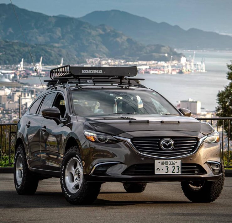 Lifted Mazda 6 Offroading with yakima cargo basket on the roof rack