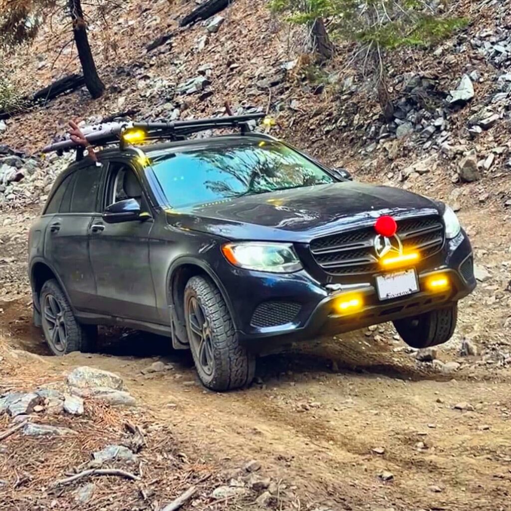 Off-roading in a lifted Mercedes GLC300 crossover equipped with off-road mods